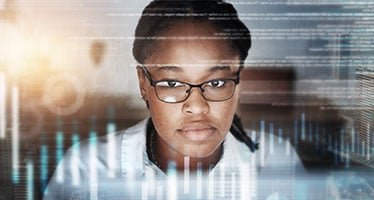 Global Finance student looks at data on a computer screen